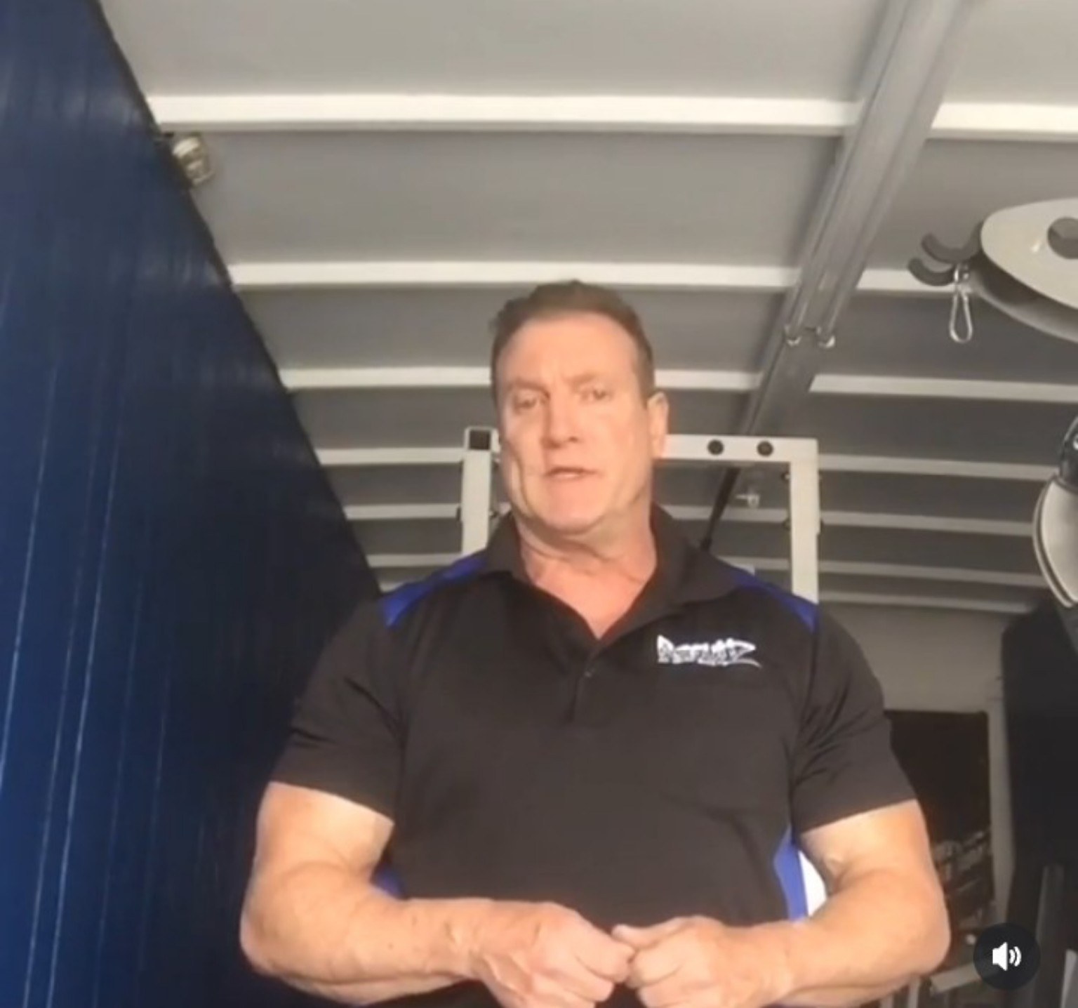 Personal trainer coaching a client on gym equipment